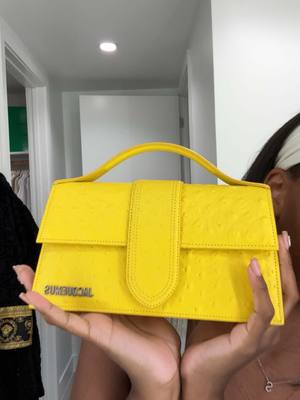 A post by @sierraxliyah on TikTok caption: I’m so in lOOoooOooOOOOOveEEEEE #fyp #foru #jacquemus #newbag #unboxing #neimanmarcus #purse #yellow #butteryellow #lemonyellow 