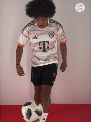 A post by @fcbayern on TikTok caption: Looks good on you, Serge! 🤩 The new #FCBayern 25/26 away jersey — celebrating 20 years of the Allianz Arena 👉  Link in bio!