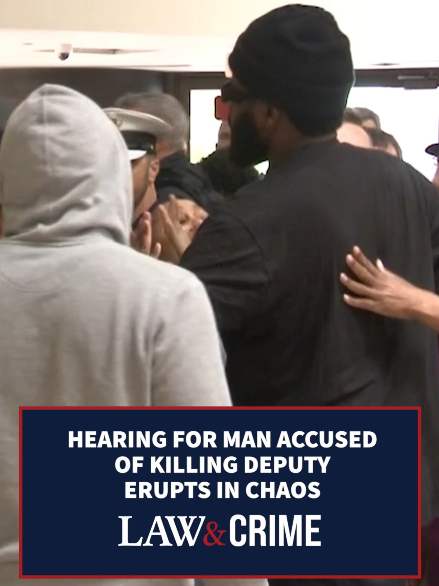A post by @lawandcrime on TikTok caption: #RodneyHinton was in court on Tuesday for a hearing that turned into chaos. During the hearing, Hinton's brother yelled out, "That's my brother," from the gallery. Hinton was immediately removed. Later, he pleaded not guilty and was denied bond. He is accused of fatally striking a deputy with a car after his son was killed by police.