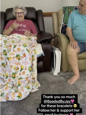 A post by @thejockandbelleshow on TikTok caption: These bracelets are adorable! They love them! Maybe one day these bracelets will help them learn their left from right 🤣🙌🏼Follow and support @Beaded By Jay 🩷 #grandparents #family #SupportSmallBusiness #gift #grandma #grandpa #funny #laugh 