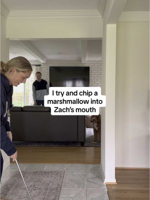 A post by @ellie_juengel on TikTok caption: Replying to @Ellie Juengel Give Ollie a few more months and he will catch it! #golfchallenge #marshmallow #couplechallenge #marriage 