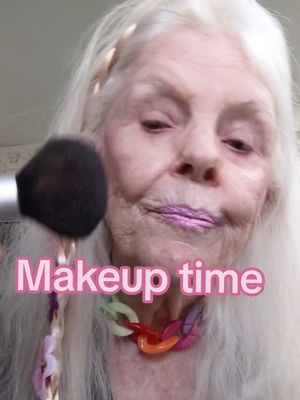 A post by @sassygrandmapat on TikTok caption: 💕💜😘 getting ready backwards today.  Dress and accessories first. I usually do my makeup first. How about you? 