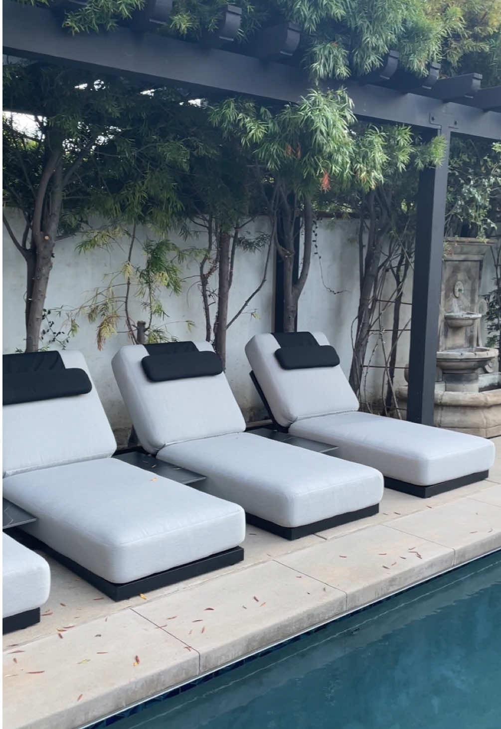 A post by @roveconcepts on TikTok caption: Unwind in style with the Florian Lounger. Videos by Erin Fetherston, @morrisandjamesinterior and @vlc__studio #RefinedLuxuryLiving #RoveConcepts #Fyp #OutdoorFurniture #FlorianOutdoorLounger 