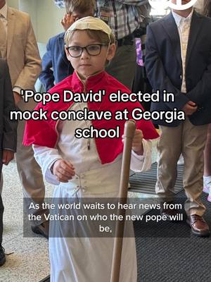 A post by @abc7newsbayarea on TikTok caption: On the day before the actual papal conclave in Vatican City, second graders at Pinecrest Academy, a PreK3-12th grade Catholic School in Cumming, Georgia, held their own mock papal conclave on Tuesday, May 6. Meet the newly elected Pope David, second grader David Levergood. Pope David made his first appearance, blessed his flock and even took a ride around in the “Pope Mobile." In celebration of the new Pope, all students received “Lolli-Popes” as a treat. #papal #conclave #newpope #pope #education #activity #lollipop #blessings #cute #fyp #fypシ #abc7newsbayarea 