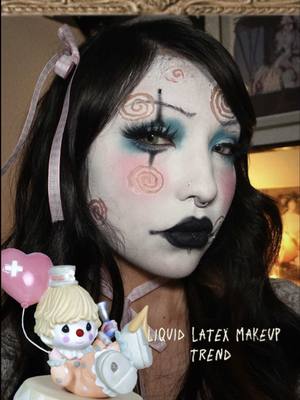 A post by @santanabarelaa on TikTok caption: liquid latex makeup trend  #makeup #makeuptrend #tutorial #vintagemakeup #trending #alttiktok #fypシ゚viral #foryoupage 