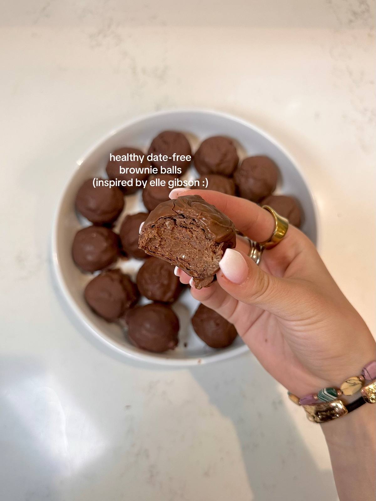 A post by @liviabenson on TikTok caption: posted the video a bit ago but just made these again after coming home from college 🍫 they are so delicoussss #brownieballs #ellegibson #healthydesserts #easyrecipe #healthyrecipes #chocolate #baking  #simpleingredients @drinkkoia 