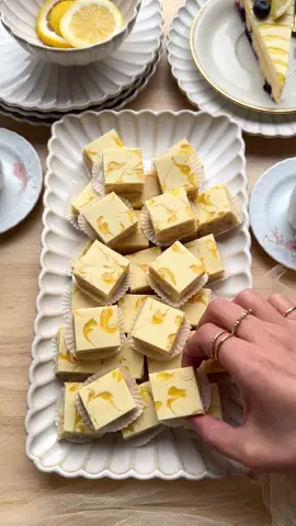 A post by @kookmutsjes on TikTok caption: LEMON COOKIES WITH COCONUT AND CHOCOLATE #food #recipe #cookies #lemontok #lemon #lemoncurd #coconut #chocolate COOKIE DOUGH 220 g Maria biscuits 75 ml heavy cream 250 g white chocolate 20 g grated coconut 50 g lemon curd TOPPING 150 g white chocolate 30 g lemon curd Roughly chop the Maria biscuits and place them in a large bowl. The pieces don’t need to be uniform, but make sure there are no whole biscuits left. Heat the heavy cream until just below boiling point. Remove from heat and add the white chocolate (250 g). Let sit for 1 minute, then stir until smooth. Let it cool slightly. Add the grated coconut, lemon curd (50 g), and cooled ganache to the crushed biscuits. Mix until fully combined. Spread the cookie dough mixture into a baking dish or mold lined with parchment paper. Press down firmly using the back of a spoon or your hands. Tip: use a sheet of plastic wrap to press it down evenly and smoothly. Melt the white chocolate (150 g) using a double boiler. Pour the melted chocolate evenly over the cookie dough. Immediately dot the top with lemon curd (30 g). Use a skewer or toothpick to create a marbled pattern.  Let it set in the fridge for 4–5 hours, preferably overnight. Cut into squares and serve.