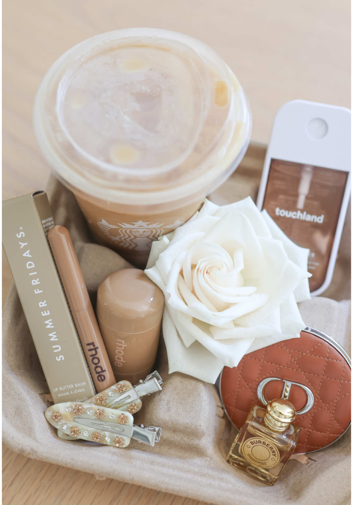 A post by @teresalauracaruso on TikTok caption: Last-minute Mother’s Day gift or just because! 🤎 Grab their favorite drink & a tray from a spot they love & fill it with their favorite things! Ty to @Aman ☕️🤎✨ for the tray inspo! #giftideas #coffeetray #rhode #touchland #summerfridays #aesthetic 