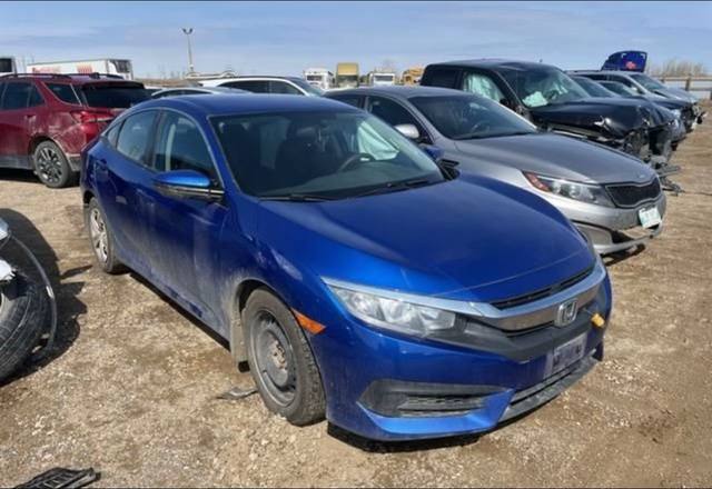 A post by @auto_canada12 on TikTok caption: 2018 Honda Civic LX 4 Door Sedan 2.0L 4 Cyl Gas Injected Auto Trans FWD Damage: Left Rear Corner  Electric Defogger, Electronic Stability Control, Front Heated Seats, Heated Mirror, Keyless Entry System l Audio Control, Cruise Control Theft Deterrent Sys. Traction Control/Electronic DM us for a free quote 