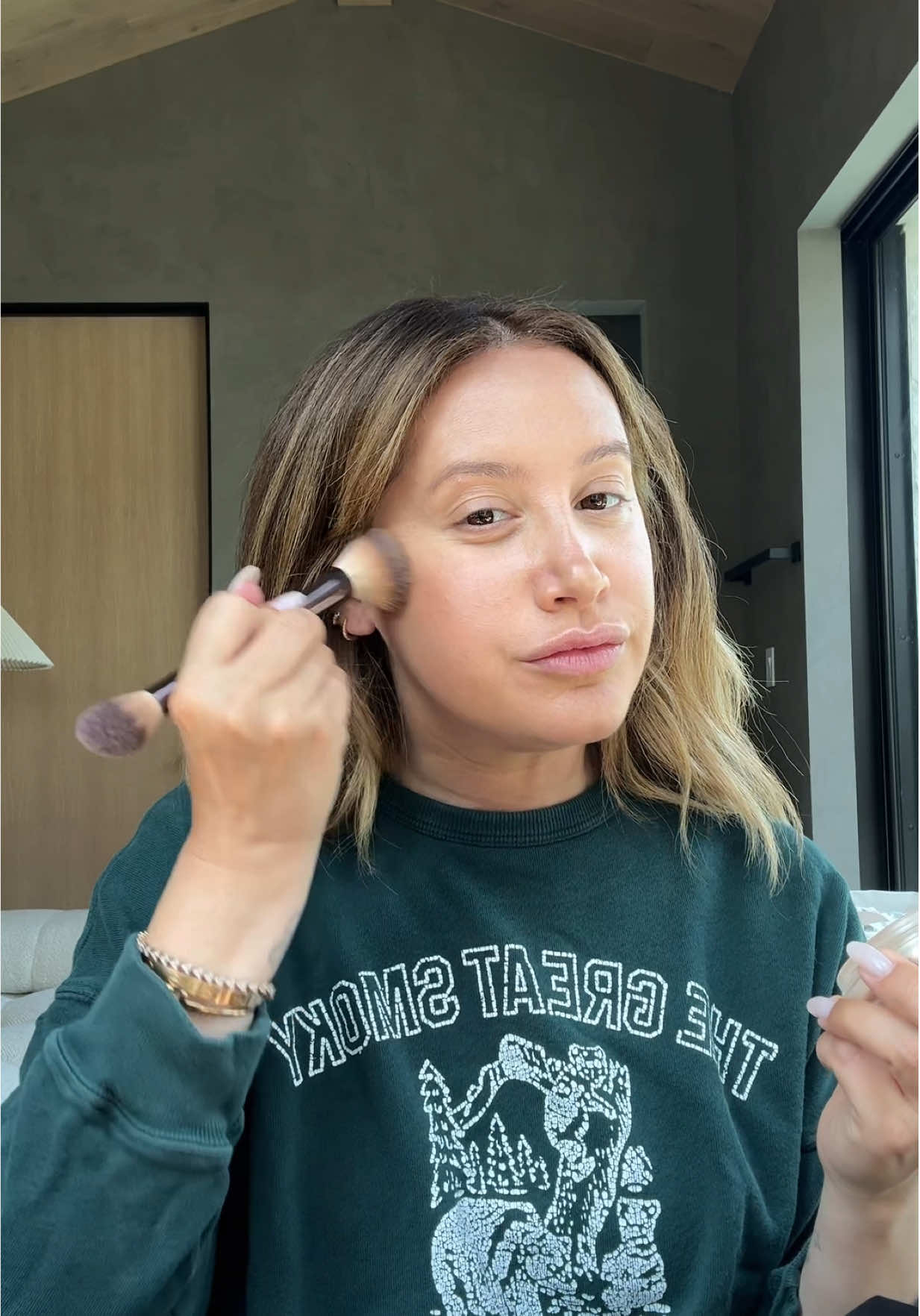 A post by @ashleytisdale on TikTok caption: A little summertime glow 🌟