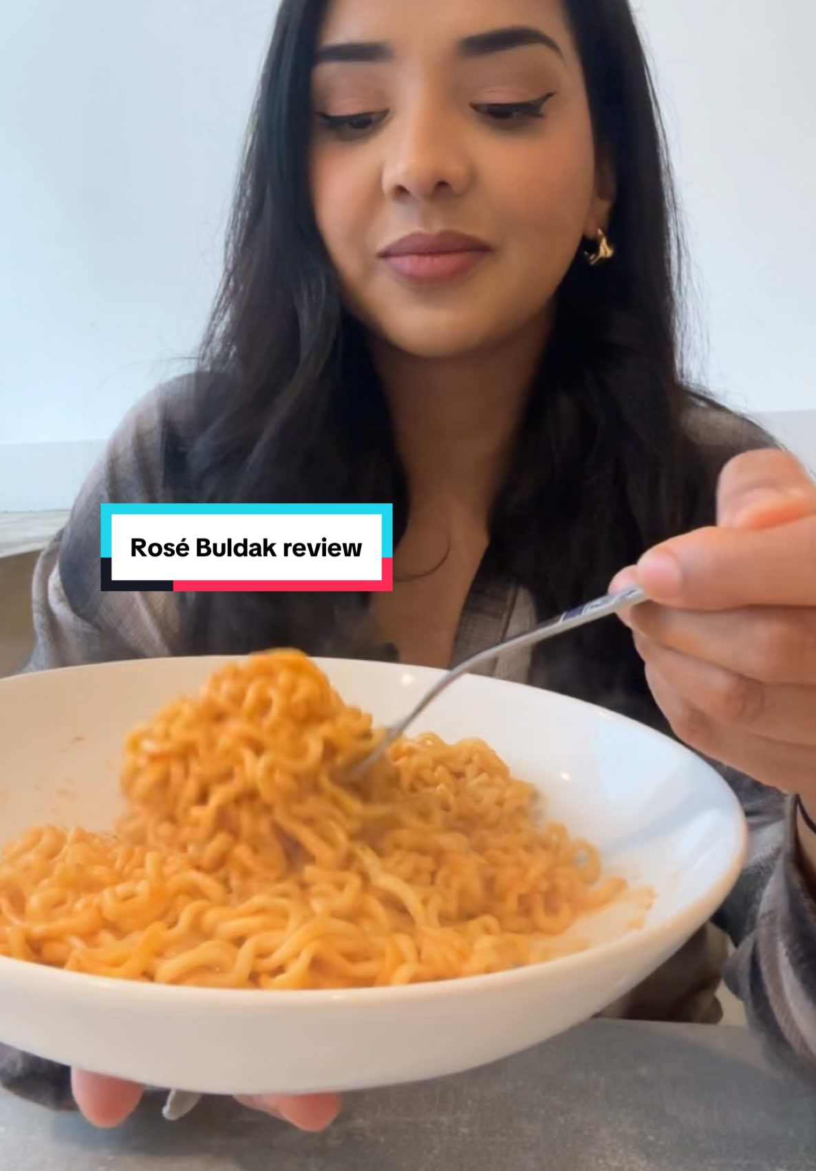 A post by @kauscooks on TikTok caption: Rose Buldak Review #ASMR #ramen #buldakramen 