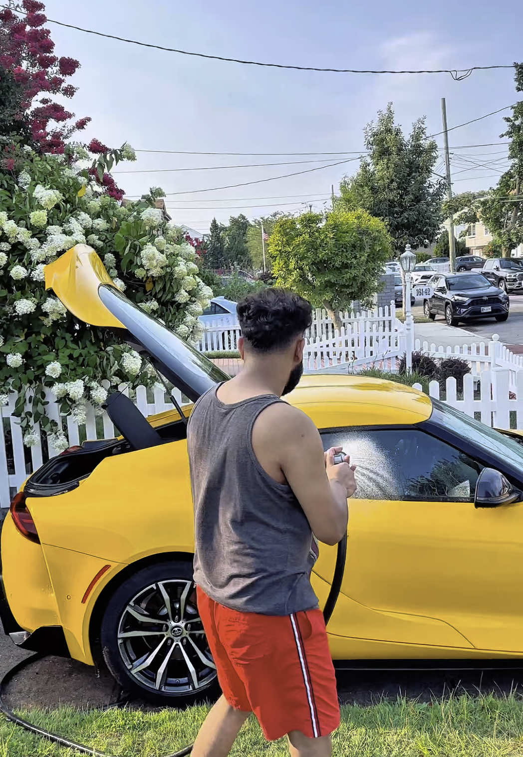 A post by @gazirifat30 on TikTok caption: Feel”the how pleasant it is to wash my car in front of the house in the summer weather#UnitedStates #citylife #enjoylife #mk5 #washes #summervibes #supra #weather #hobbies #summervibes #newyork #howerdbeach 