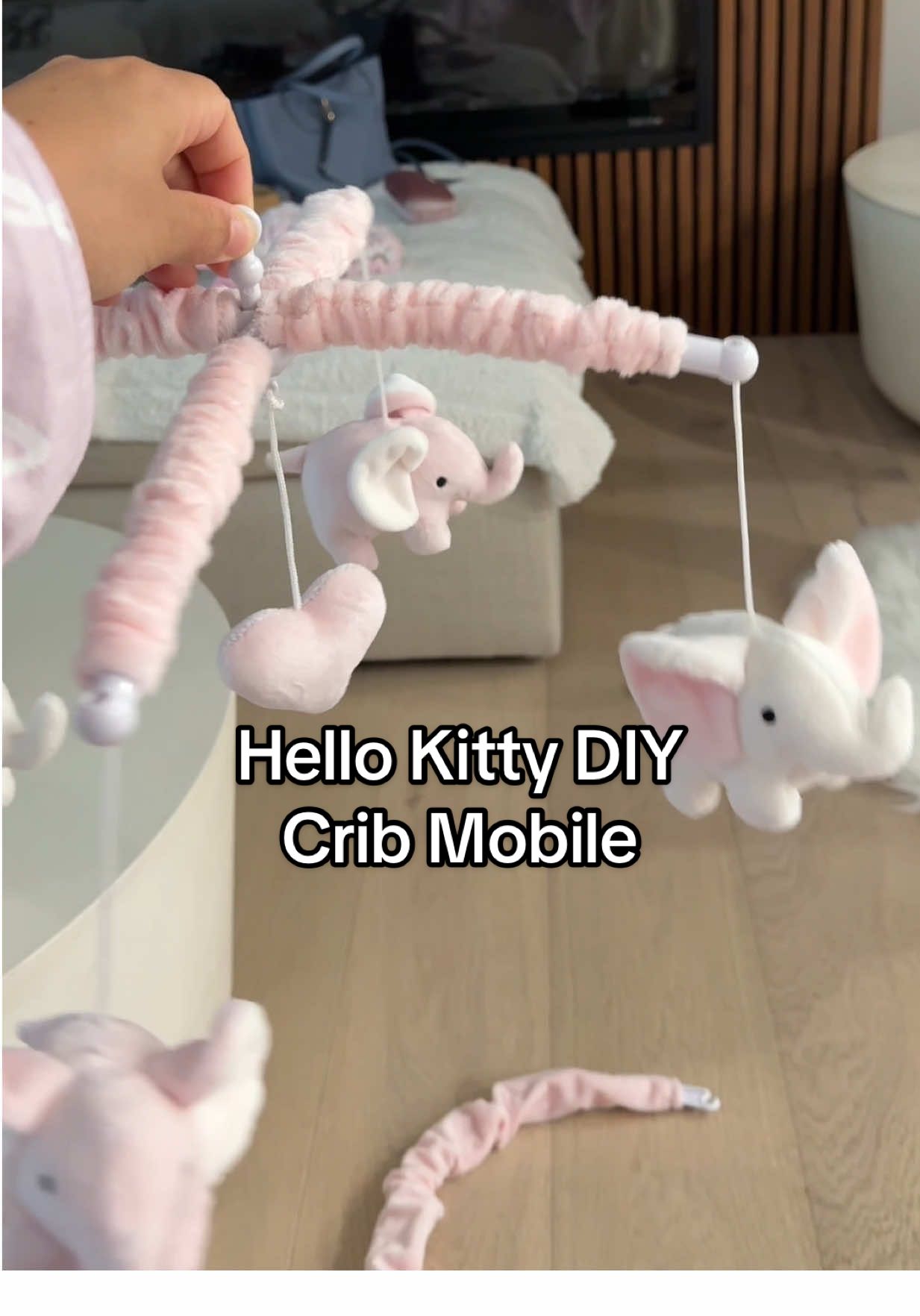 A post by @coileray on TikTok caption: I made my daughter her own Hello Kitty mobile for her crib because they are sold out everywhere 💖💖💖