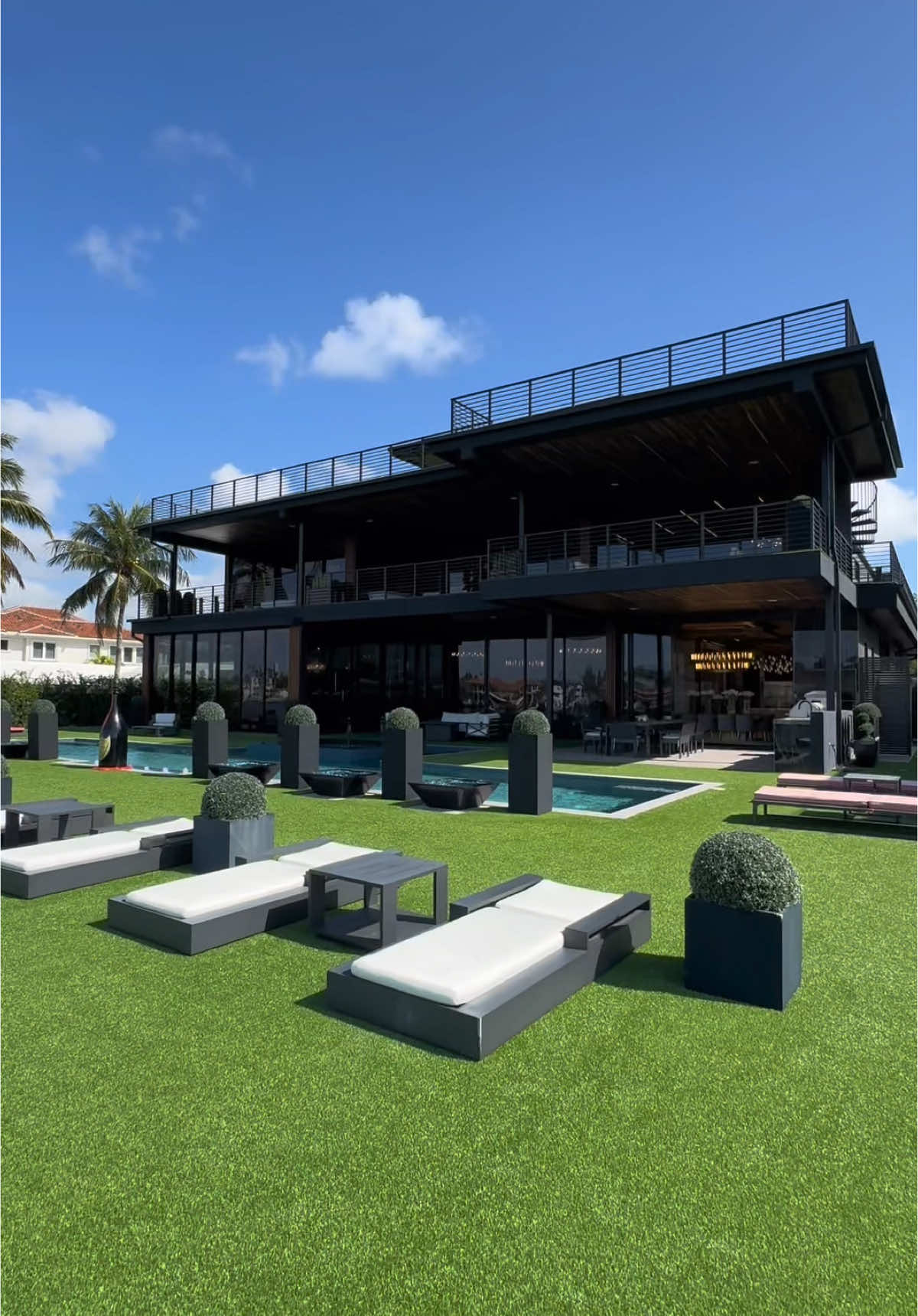 A post by @luxlistings on TikTok caption: This $47.9M Fort Lauderdale estate has 108 feet of deepwater frontage — and a drone landing pad to match. Would you live here?