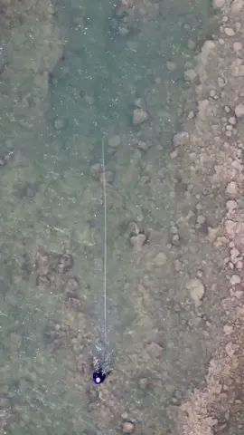 A post by @simmsfishing on TikTok caption: No matter your musical taste, some tunes just resonate with everyone. Same goes for fishing, there are some sounds you always hope to hear no matter what fish you are targeting. #FishItWell #SoundTrack #Drag   🎥: @flyinspired   #SimmsFishing #Steelhead #SpeyFishing #Swinging #TwoHandRod #FlyFishing #GreatLakes #Fishing 