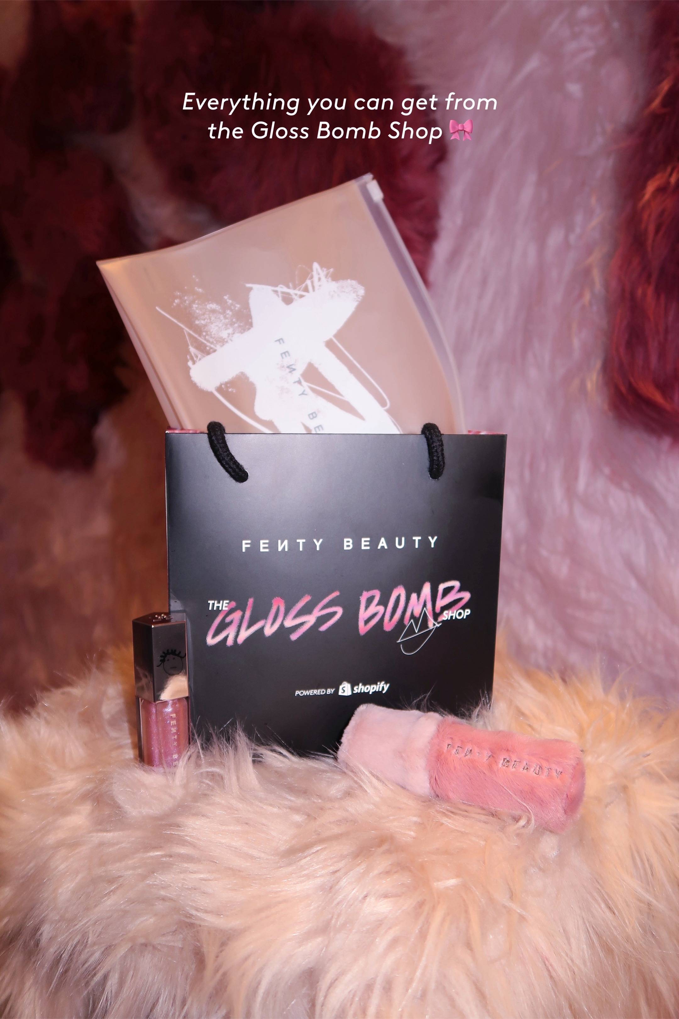 A post by @fentybeauty on TikTok caption: We’re glossin’ up in the city that never sleeps with exclusives you can ONLY cop at our Gloss Bomb Shop pop-up in New York! ⭐️ Limited-edition #GlossBomb in Grape Splash ⭐️ Buy 3 items = get a cutesy Fenty Beauty bag ⭐️ Buy 4 = bag + fuzzy keychain ⭐️ Buy 6 = all that + gemify your own Gloss Bomb Pull up tomorrow 5/10 or Sunday 5/11 from 11 AM-6 PM! RSVP or just walk in. First come, first served. 131 Greene St, New York, NY 10012 GlossBombShop.com