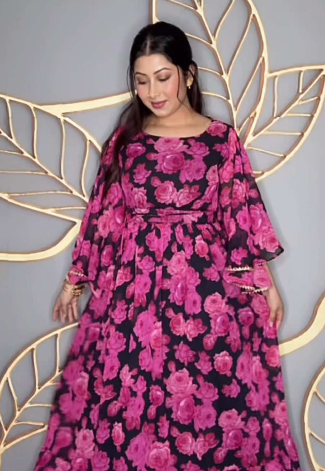 A post by @desi.sparkles on TikTok caption: Follow us on Instagram for these beautiful loral, flowy, and beautiful—featuring soft butterfly sleeves. This long gown is perfect as a single dress, abaya, or even styled as an Anarkali with a solid dupatta! @Desi_duha_boutiques 