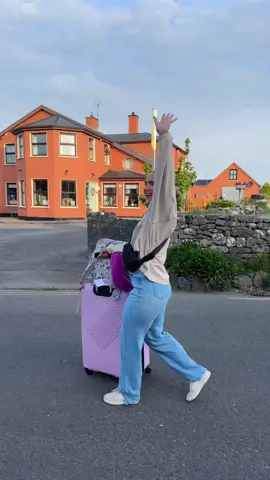 A post by @taylor_budd on TikTok caption: my huge pink suitcase in the country of ireland 