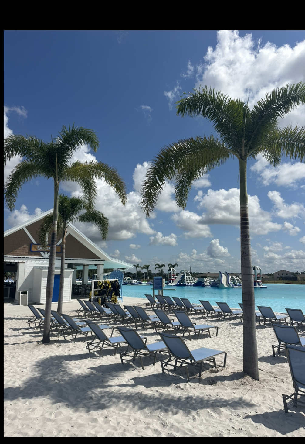 A post by @thingstodo.florida on TikTok caption: Take in the sparkling blue waters and many water activities in North Fort Myers, Florida at Brightwater Lagoon!  Enjoy everything from water obstacles to water slides, a swim up bar, and so much more at this brand new lagoon! Next time you’re looking for a day of fun in the Florida sun, check out @MetroLagoons Brightwater Lagoon in Southwest Florida! 🏝️ • • • • • #brightwaterlagoon #metrolagoons #lagoon #beach #fortmyers #northfortmyers #swfl #beachvibes #thingstodoflorida 