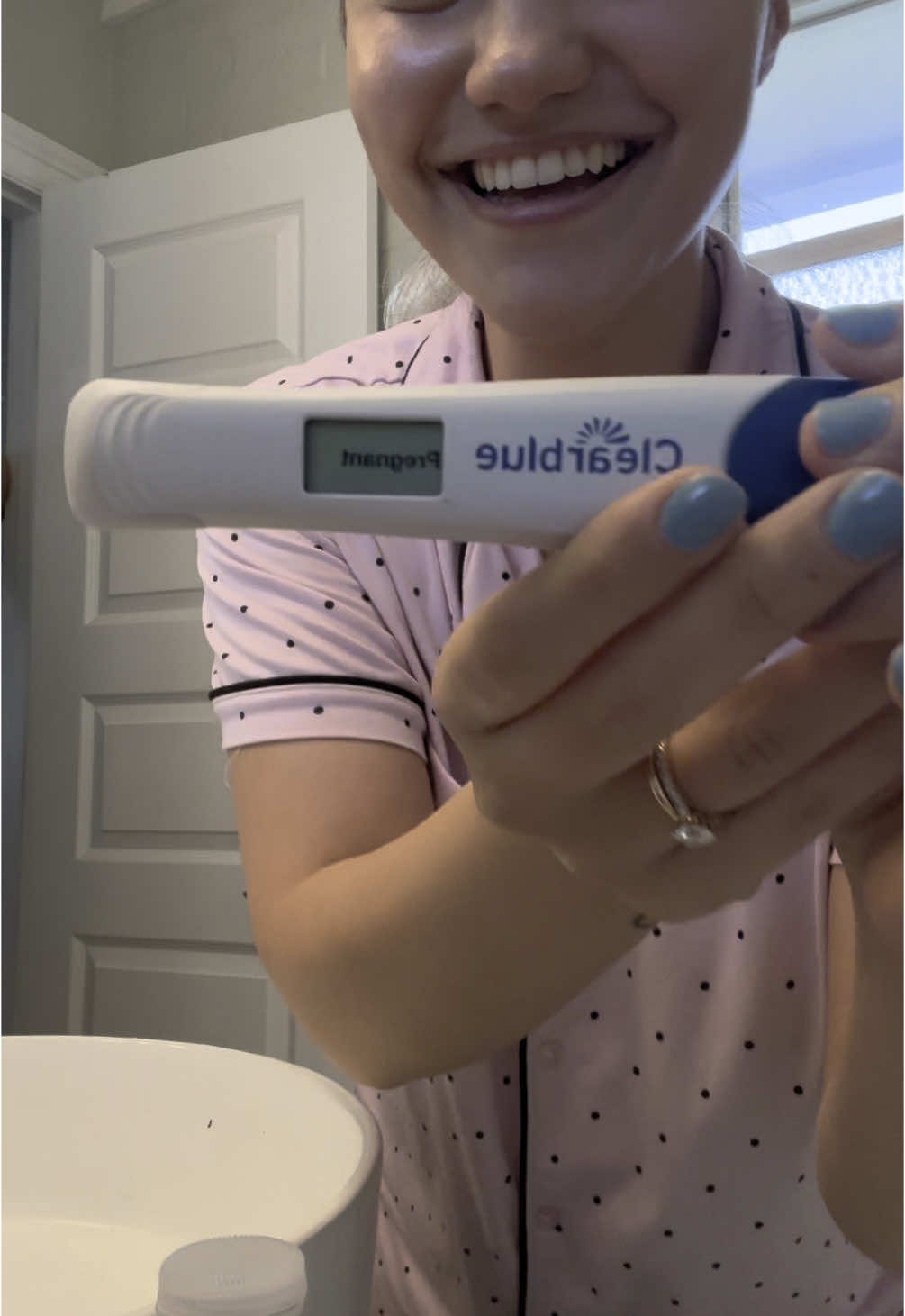A post by @itsmirna on TikTok caption: Watch me find out I’m pregnant after trying for 4 months 🥹 #fyp #pregnant 