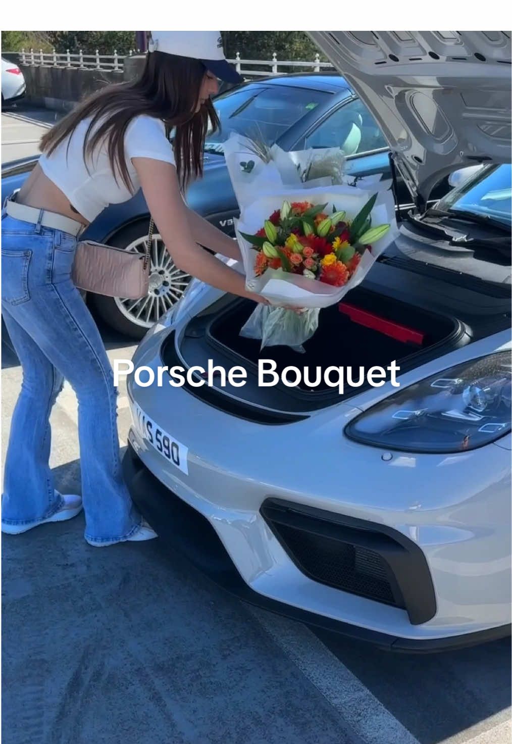 A post by @porsche on TikTok caption: Flower power meets horsepower. 💐 📼@Yas | 590 