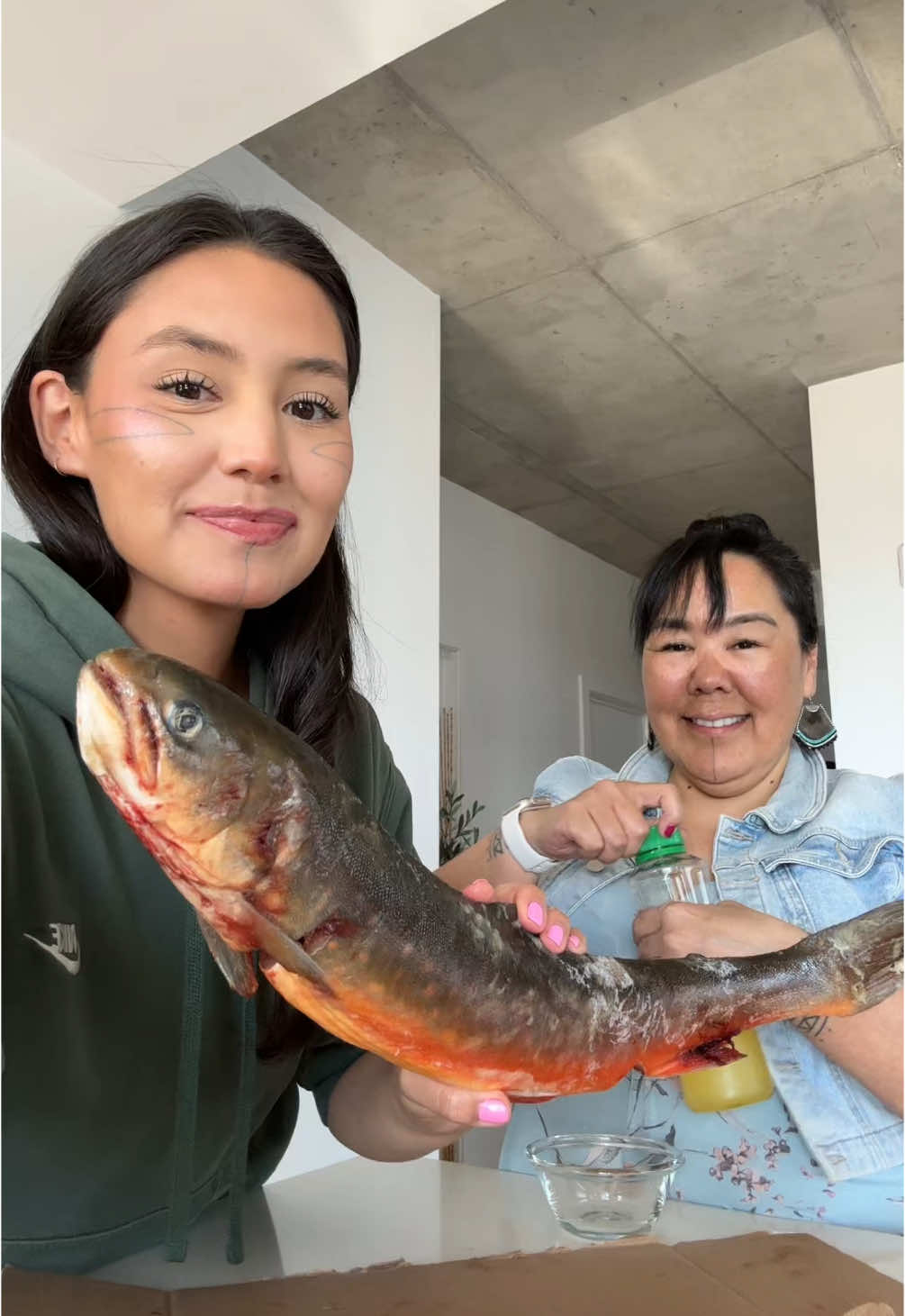 A post by @shinanova on TikTok caption: Raw arctic char we caught for lunch w/ mom 