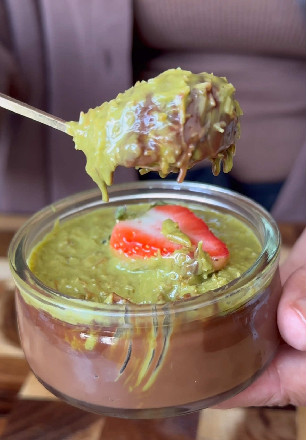 A post by @kauscooks on TikTok caption: Dubai Chocolate Ganache Pots  [AD] Made using the Pots & Co Double Chocolate Ganache pots - crafted with 100% natural ingredients! These are indulgent enough on their own, but with this Dubai-inspired pistachio kunafa twist, they become even more decadent. Perfect for hosting when you want an easy yet impressive dessert that lets you focus on the mains! Ingredients (tops 6 pots): * 150g kadayif/kataifi pastry * 1 tbsp butter * 5 tbsp pistachio crème * 1 tbsp tahini Method: 1. Finely chop the shredded phyllo (kadayif/kataifi). 2. Melt butter in a pan, add the kadayif, and toast until 80% browned — around 15–20 mins, stirring often. 3. Transfer to a bowl and mix in the tahini and pistachio crème. If using pistachio butter, add condensed milk to sweeten. 4. Mix well until smooth and slightly loose — we’re using more pistachio crème so it doesn’t set too firm. 5. Spoon 1–2 tbsp over each ganache pot, top with a sliced strawberry, and chill. Let sit at room temp for 20 mins before serving Pistachio, chocolate, ganache, kunafa, easy desserts #pistachio #kunafa #chocolate #ganache #dubaichocolate #dessertideas #easyrecipe #easyrecipes 