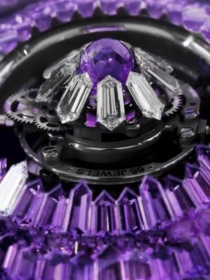 A post by @jacobandco on TikTok caption: This is what happens when fine watchmaking meets fearless gem-setting. The Mystery Tourbillon 44MM dazzles with 260 hexagon-cut white diamonds on the case, a crown of 250 baguette-cut amethysts around the mystery rings, and a triple-axis flying tourbillon glowing from within — set with a Jacob-cut amethyst and nine diamonds. Built to mesmerize. Powered to perform. #Inspiredbytheimpossible #jacobandco