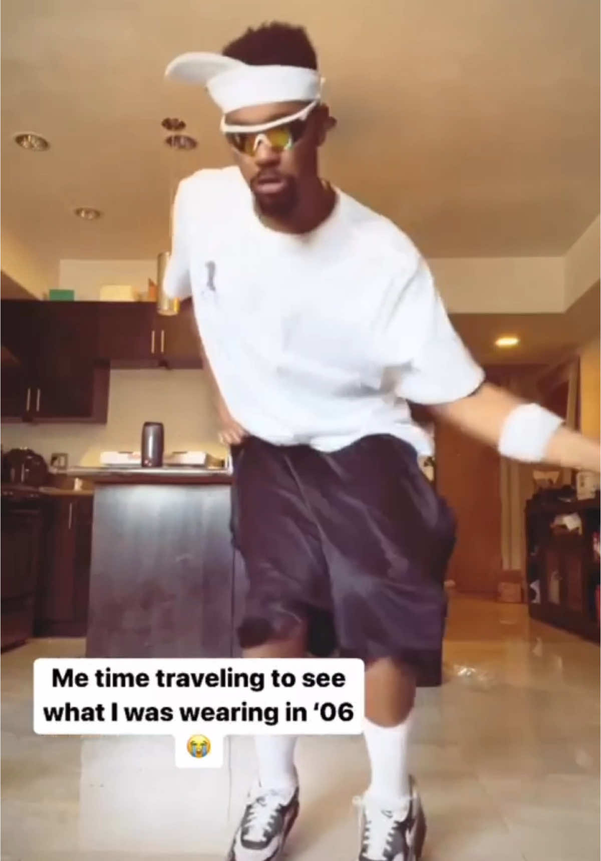 A post by @officialreggiecouz on TikTok caption: The upside down visor had us in a CHOKEHOLD!! 😂😭 ONG #2000s 