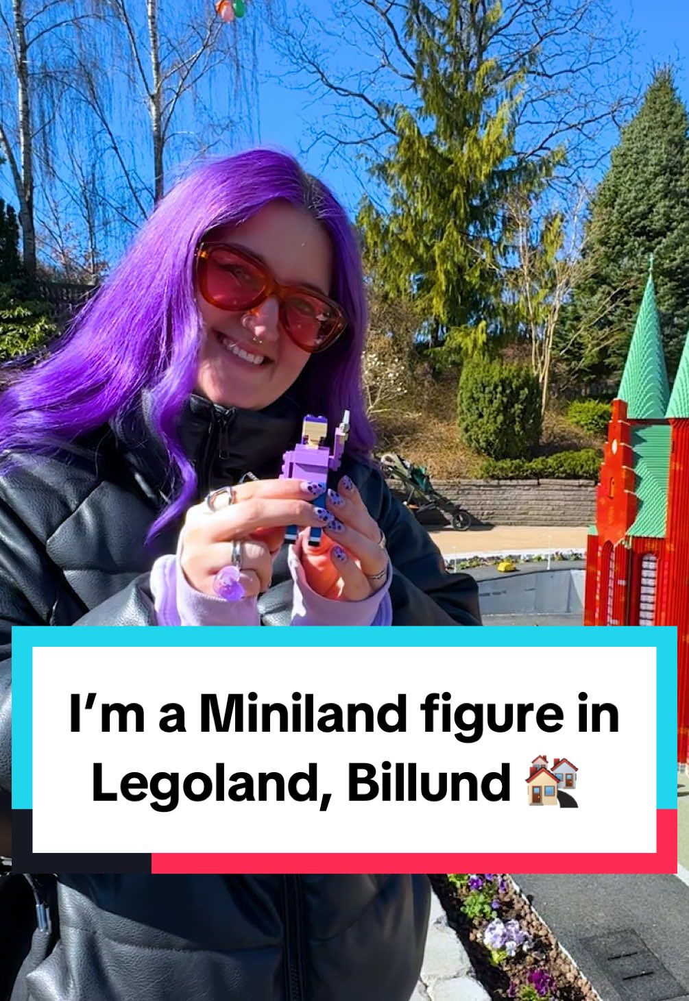 A post by @kellylouisekilljoy on TikTok caption: Advertisement @legolandbillund | I took you behind the scenes of how Legoland, Billund’s new Miniland exhibition came together BUT Legoland had a surprise for me!  Watch how I became a permanent resident in their new Aarhus exhibition! And why my hair has been purple for so long 😏 #legoland #legolandbillund #denmark #aarhus 