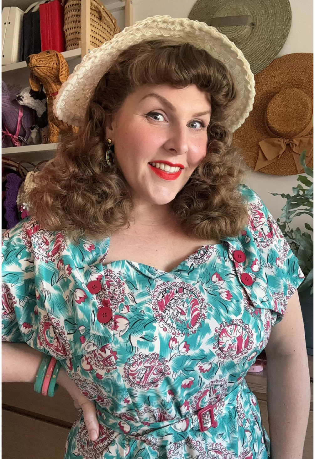 A post by @hollandschmeisje on TikTok caption: OOTD for a nice sunny mundane human day! Fluffy hair thanks to @Reuzel Pomade Vintage starlet lippy by @Dafna Beauty jewellery is @Splendette and dress is @RocknRomance  #truevintage #vintagehair #vintagestyle #1940sfashion 