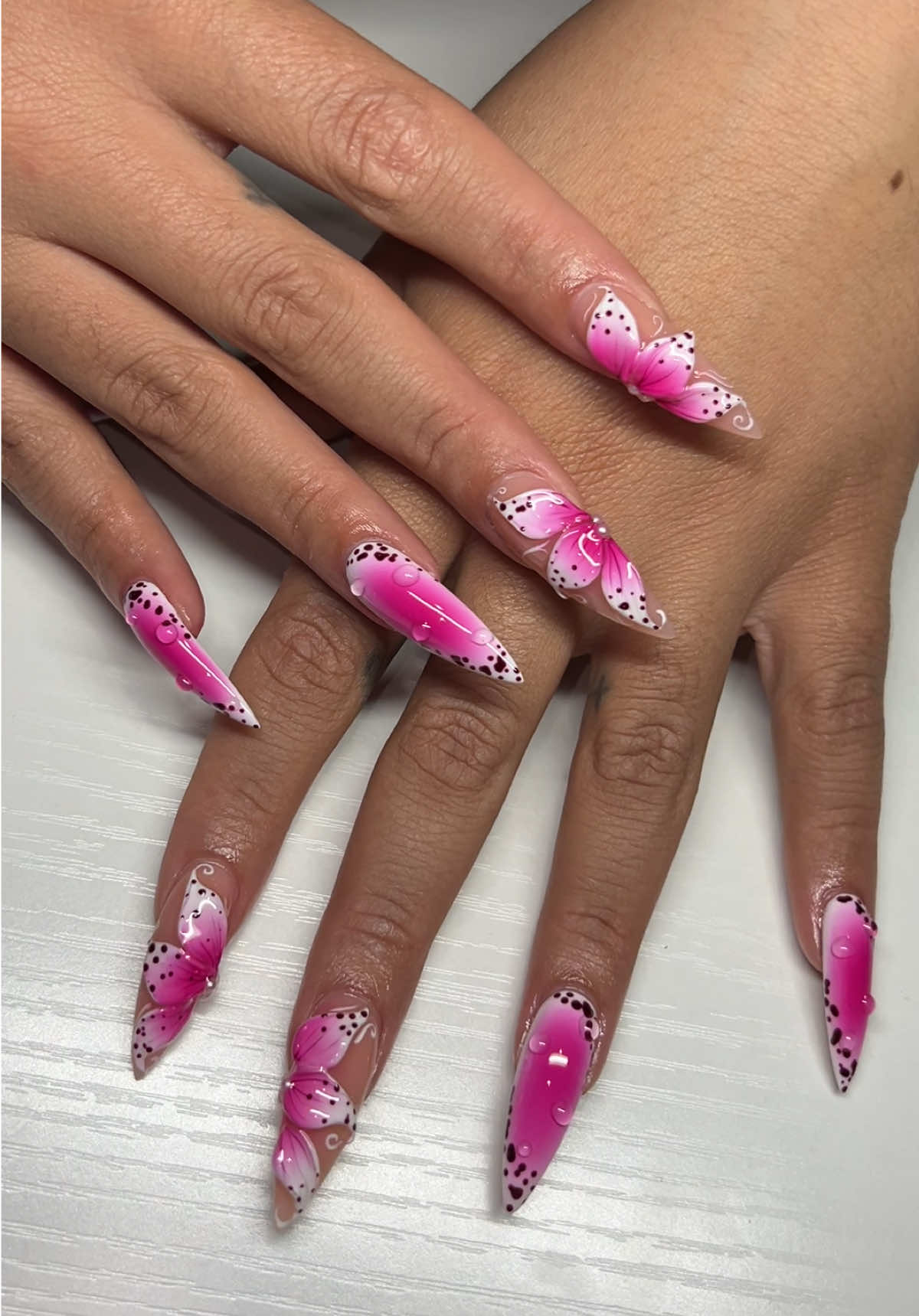 A post by @paige_mariah on TikTok caption: April showers bring May flowers ☺️🌸 #newnails #3dnailart #3dflowersnails #chicagonails 