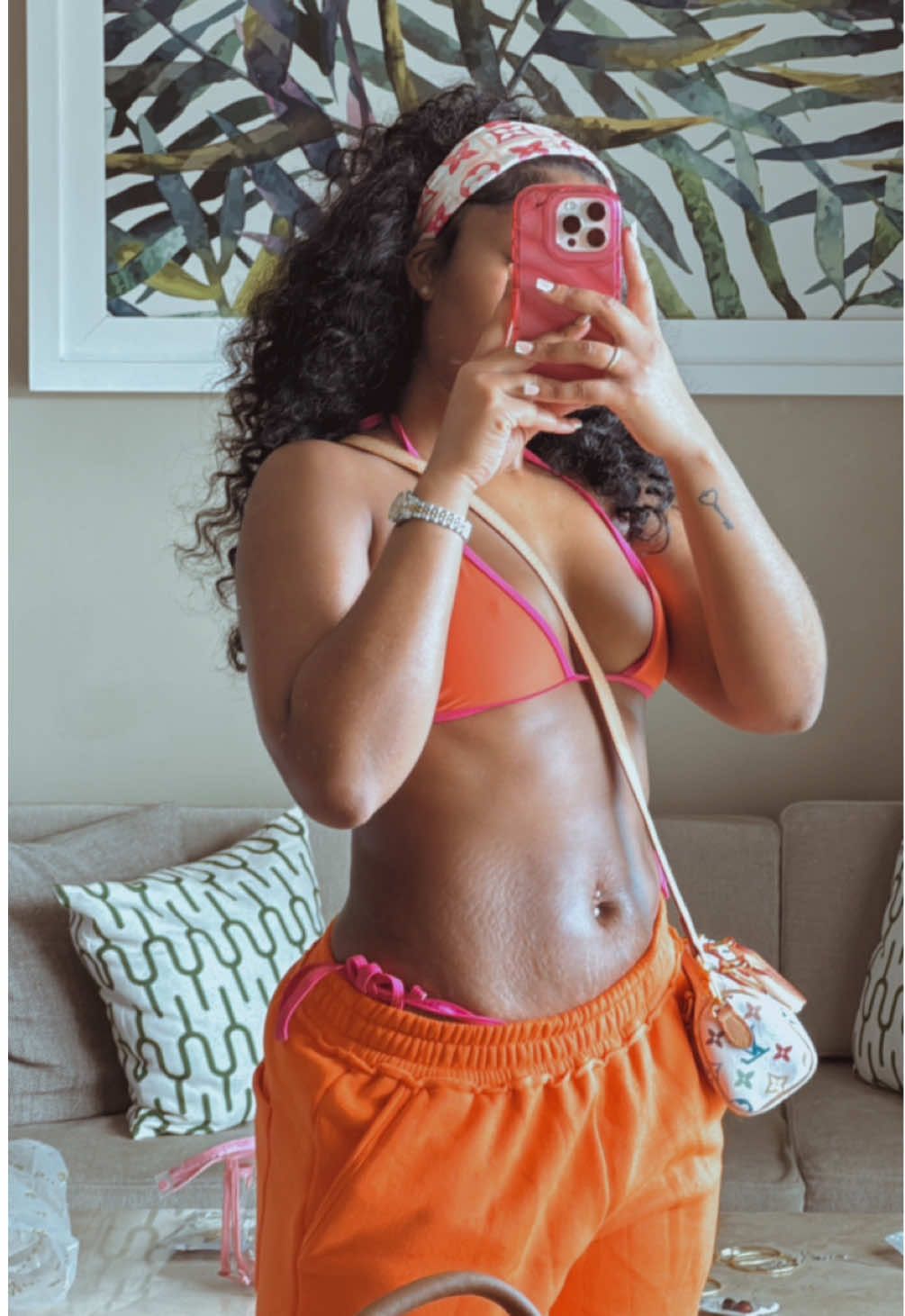 A post by @ on TikTok caption: We love a vacation look! 🩷🧡 *details linked on my LTK* #fyp #OOTD #vacationoutfits #CapCut 
