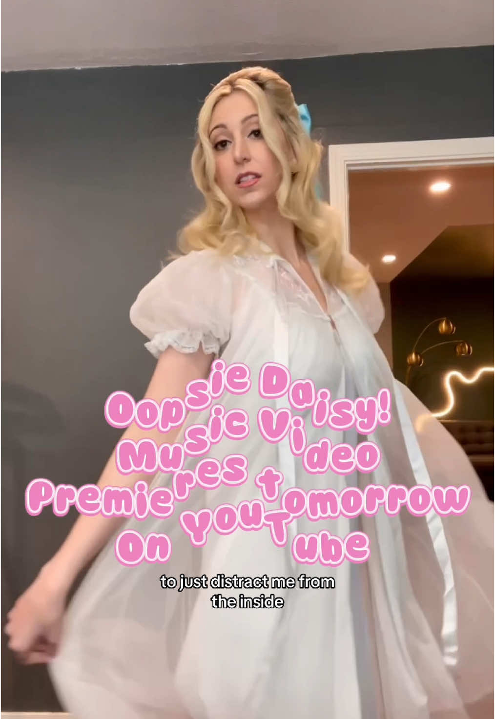 A post by @withakerika on TikTok caption: OOPSIE DAISY, I made a music video 😱 eeeee I hope you’ll watch!!! #originalmusic #musicvideo #50s #retro #millennial #makeup #makeuptransition #costume #vintage 