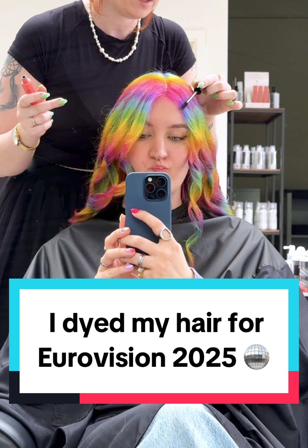 A post by @kellylouisekilljoy on TikTok caption: I dyed my hair in all the colors of the rainbow for Eurovision 2025! 🪩 This appointment was gifted to me by haircolor specialist Nina Nordskov @Mood studio 🌈 #hairtransformation #eurovision2025 #rainbowhair 