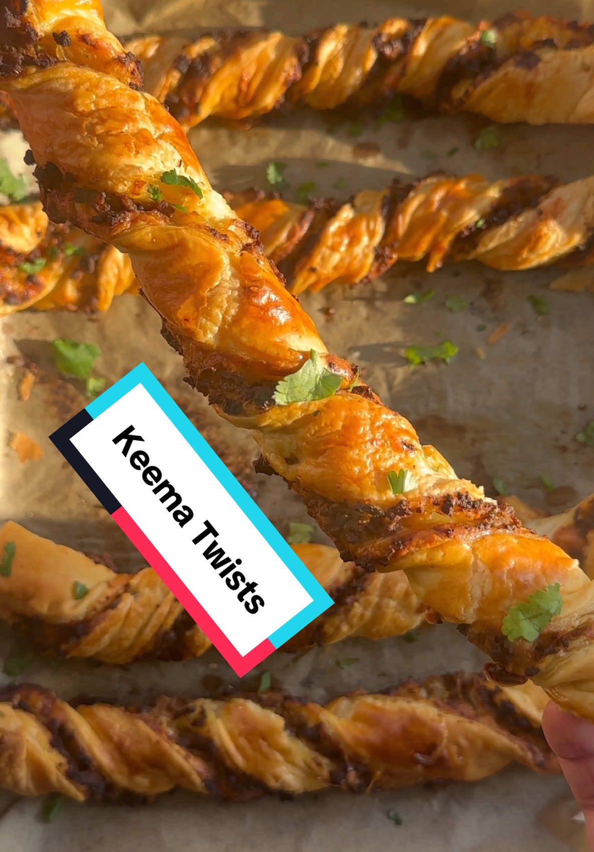 A post by @kauscooks on TikTok caption: Keema Twists Recipe Recipe (makes 12 long twists or 24 short) * 2 tbsp oil * 1 medium onion, finely chopped * 1 tbsp garlic ginger paste * 500g lean lamb or beef mince * 1 tsp kashmiri red chilli powder * 1 tsp ground cumin * 2 tsp ground coriander * ½ tsp garam masala * ½ tsp turmeric powder * 1 tsp salt (or to taste) * 1 tbsp tomato puree * 1 cup water * 2 tbsp fresh coriander, chopped * 100g grated cheese  * 2 puff pastry sheets Method 1. Heat oil in a pan over medium heat. Add the chopped onion and cook for 2–3 minutes until softened. Add the mince, garlic and ginger paste, and all the spices. Increase the heat to medium-high and cook for 10–15 minutes, breaking up the meat until browned and the liquid has evaporated. 2. Stir in the tomato purée and cook for 5–6 minutes, mixing regularly. Add the water, cover with a lid, and simmer on low for 15 minutes. 3. Once the mixture is dry, stir in the chopped coriander and set aside to cool. Add fresh chillies if you like extra heat. 4. Once cooled, roll out the puff pastry. Spoon over the keema (use half if using one sheet), add grated cheese (I used cheddar), then top with the second sheet of pastry. Gently roll over with a rolling pin to seal. 5. Slice into 12–13 thin strips, twist, and place on a lined baking tray. For smaller twists, cut each strip in half. You can freeze some for later by placing the entire baking tray in the freezer for 3 hours then transferring into freezer bags once frozen and cook straight from frozen at a later date. 6. To enjoy right away, brush with egg wash and bake in a preheated oven at 180°C (fan 160°C) for 20–25 minutes until golden. Serve with mint chutney. #keema #puffpastry #snack 