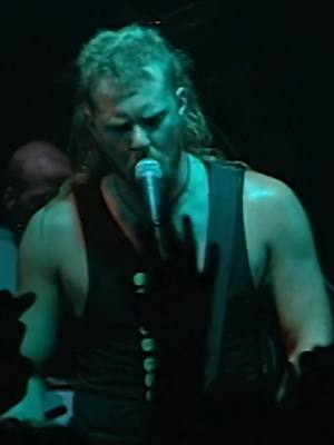 A post by @metallica on TikTok caption: August 23, 1995: A little over four years after the release of The Black Album, a small crowd at the Astoria 2 in London was the first to hear “new” Metallica music. Led by James’ Ulta-Mullet, we launched into “2 x 4,” a greasy groove about a piece of wood. See this alongside other performances of the song from Donington & Tuktoyaktuk within the “Load” Remastered Deluxe Box Set, coming out on June 13. In the meantime, watch the full vid on our YouTube channel.