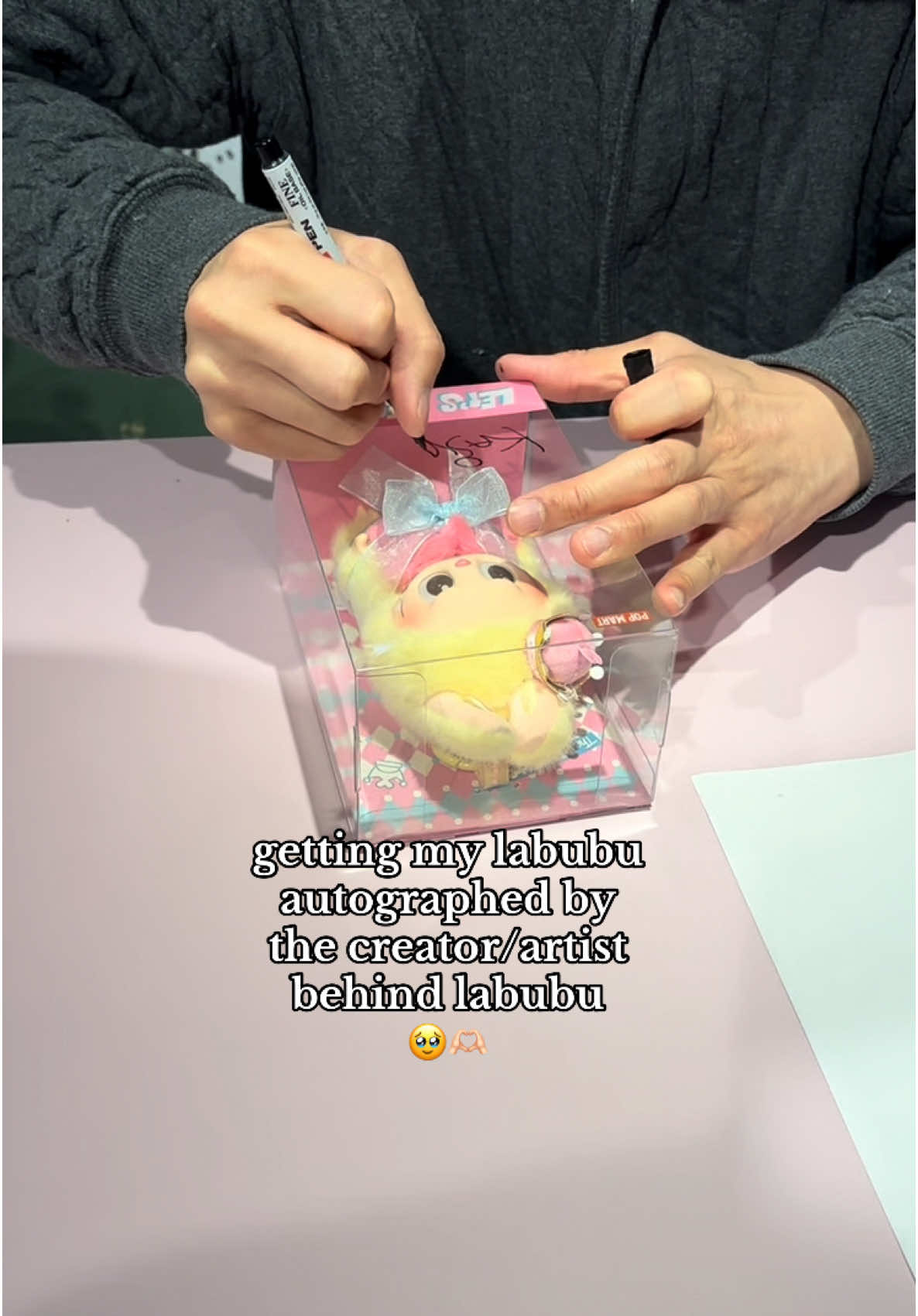 A post by @nintendo.grl on TikTok caption: I got the chance to meet the creator/artist behind Labubu, Kasing Lung, and he signed my Labubu!! he was so sweet 🥹🫶🏻💕@POP MART UK // #labubu#popmart#labubus#blindbox#blindboxes#trinkets 