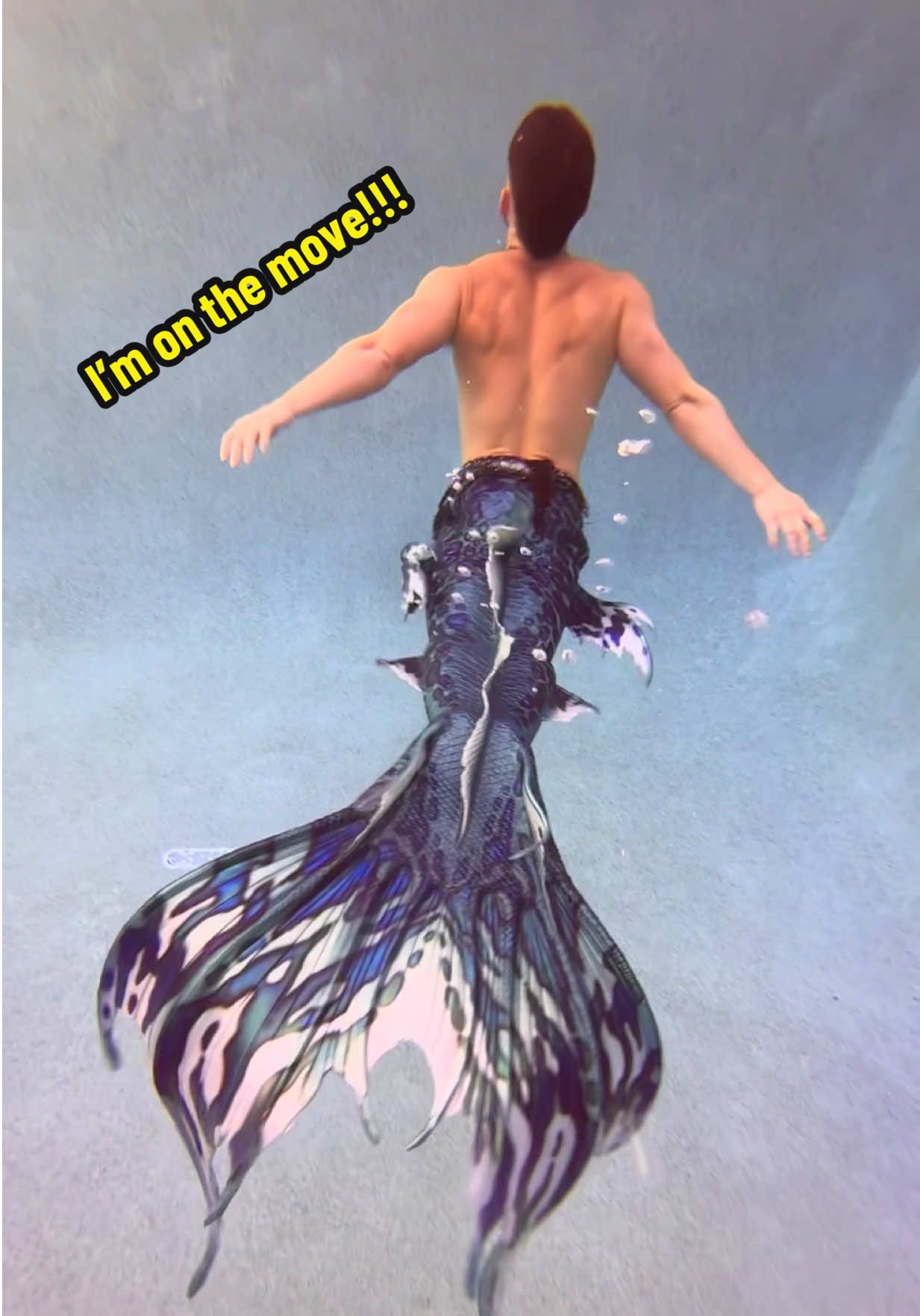 A post by @mermanthommy on TikTok caption: 🫧 I’m On The Move — always.🧜🏻‍♂️🌊 Quick clip in Ailea, my Merbella tail. Clean lines, serpent flow, no slow motion needed. 🐍 If you’re new here, welcome to the deep end. 💦  Drop a wave if you’re new. 🌊  Save this for underwater inspo. 💚 Tag someone who’d try this tail. 🫵🏼@Merbella Studios 