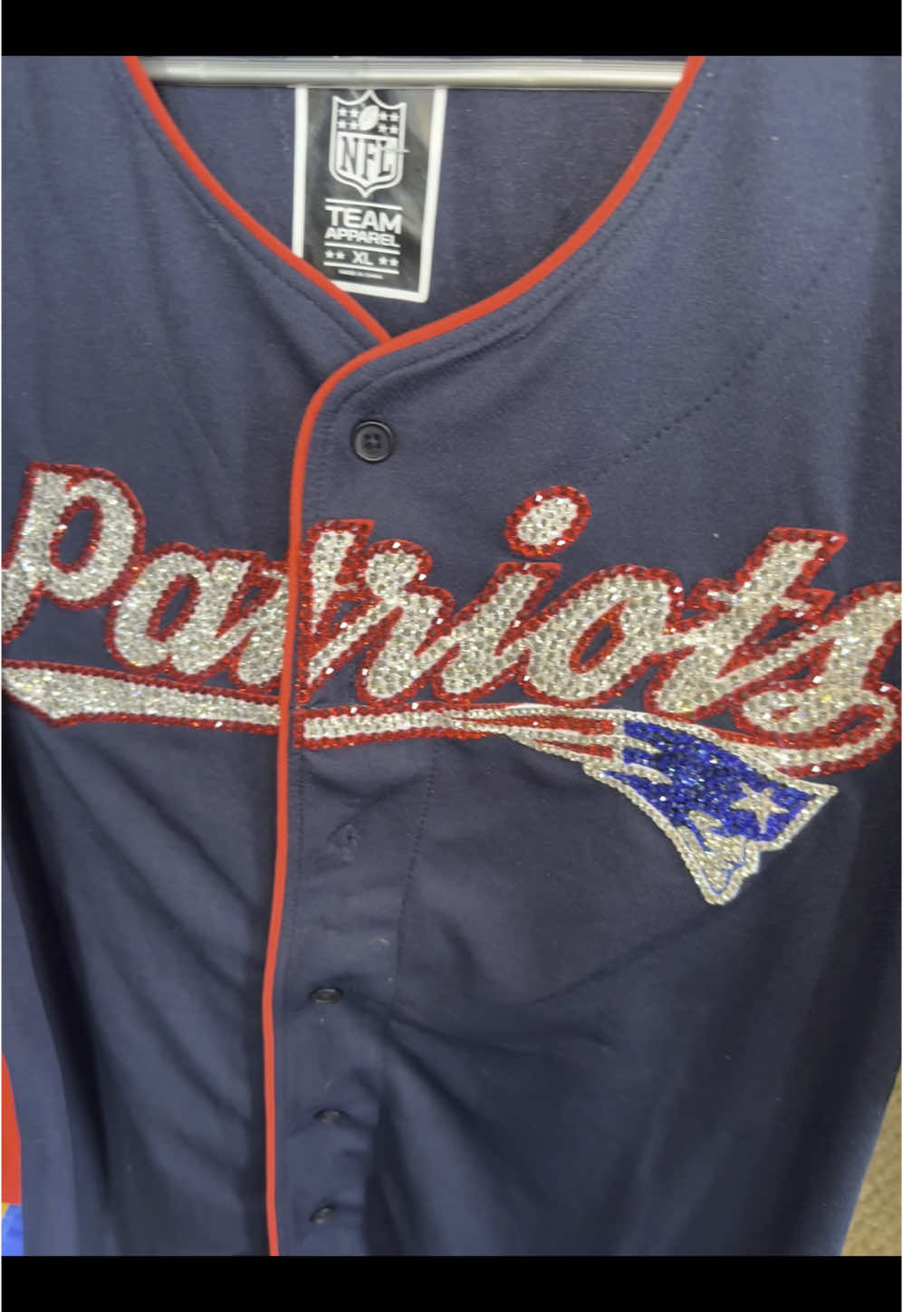 A post by @calibornbree on TikTok caption: Team: Patriots  Size: XL This can be oversized M-L! Style it up!  Sale cost: $120  Ship: $9 Yes I do take custom orders on all teams!  ##Patriots##NFL##rhinstones##bling