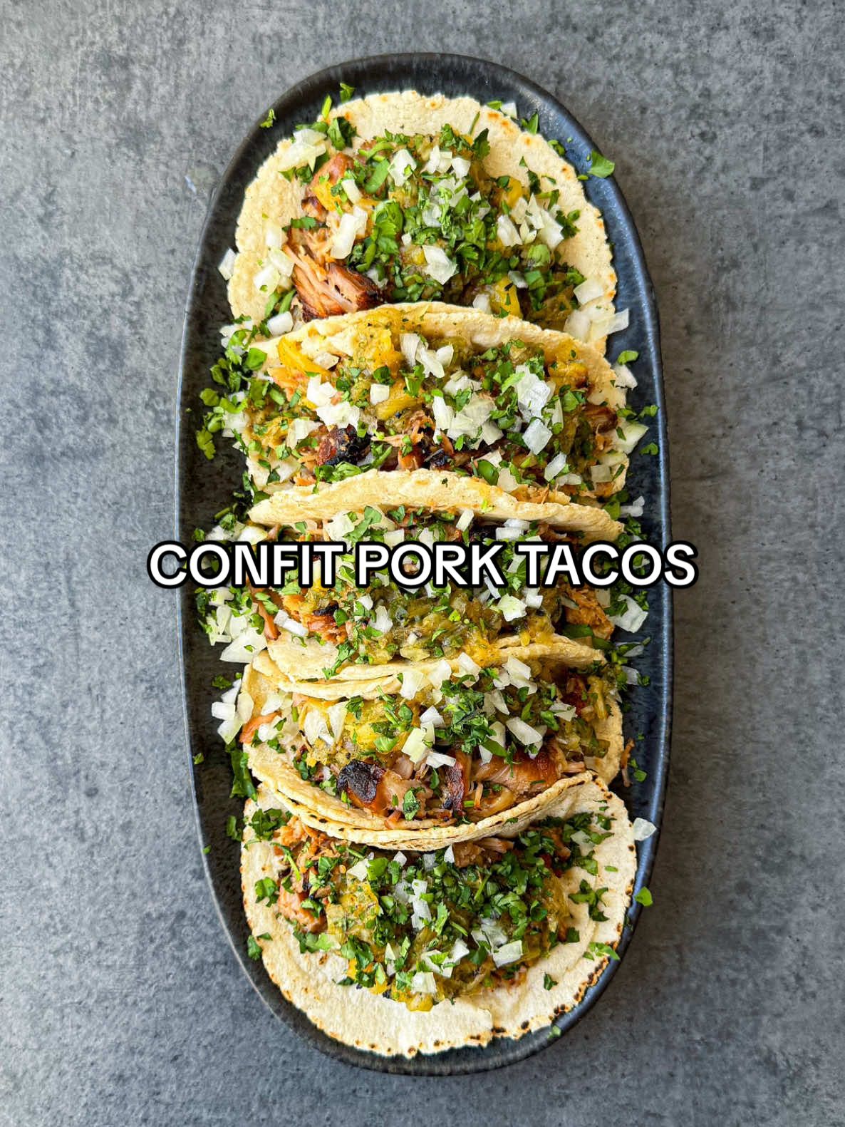 A post by @samseats on TikTok caption: Confit Pork Tacos 🌮 Full recipe up on my Substack, link in bio! ❤️🔥 #tacos #datenight #comfortfood #recipe #asmr 