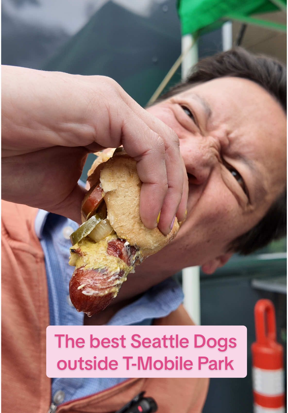 A post by @j.kenji.lopezalt on TikTok caption: A Seattle dog is a hot dog with cream cheese and grilled onions. Sounds weird but when done right, it’s a magical combination. So who serves the best Seattle dog outside of T-Mobile Park before the @Seattle Mariners game? I tried them all to find out. Wondering exactly what the deal with Seattle dogs is? Check out my new post “What’s the Deal with Seattle Dogs” available to read for free on my Patreon (link in bio). And tell me: what’s your favorite regional hot dog?