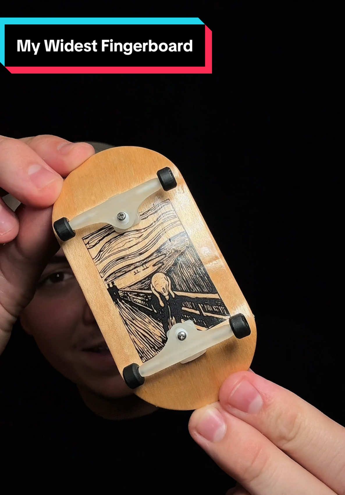 A post by @jakepfb on TikTok caption: What’s the WIDEST board you’ve used?🧐🤯  #fingerboard #fingerboarding #fingerskate #miniskateboard