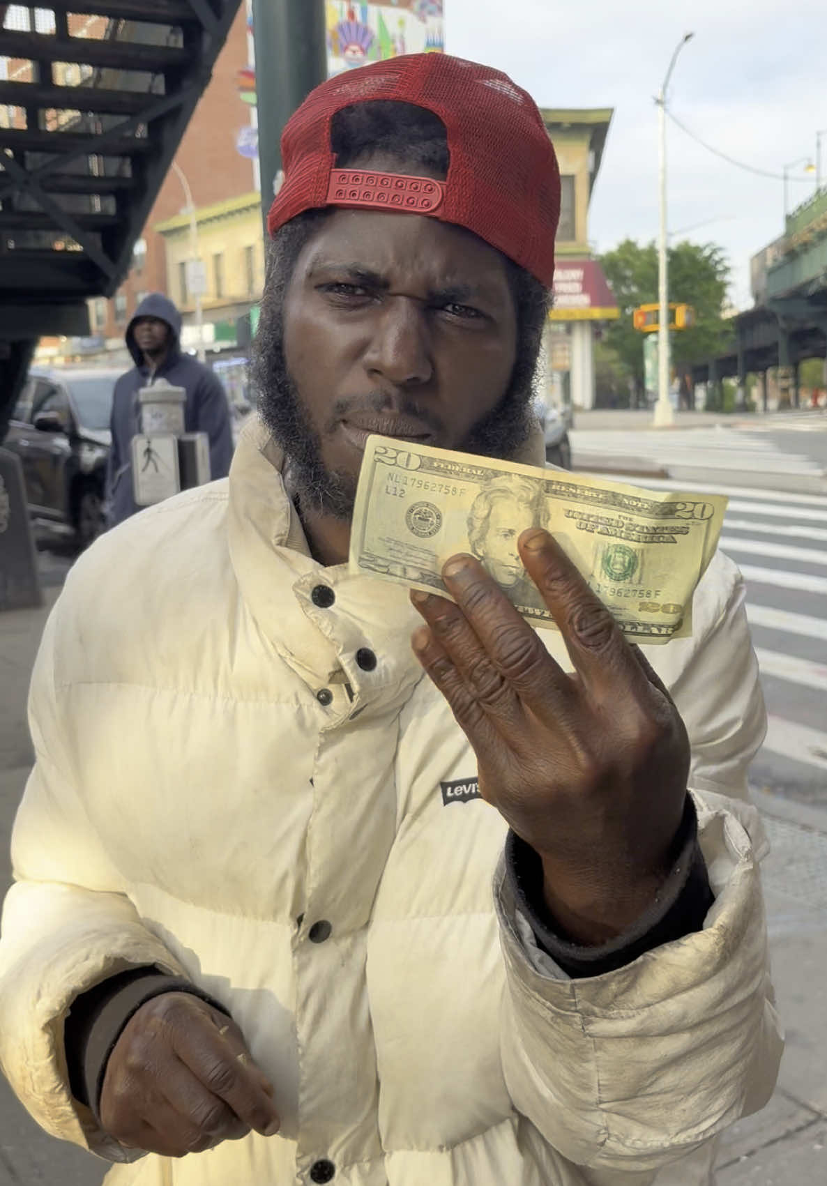 A post by @thetraynycshow on TikTok caption: Ran into my son @bighommiebuzzo 😂😂😂 had to show love and give him 21 cash that’s what he wanted !! ❤️ love is love #fyp #nyc #iamtraynyc #bighommiebuzzo #bronx 