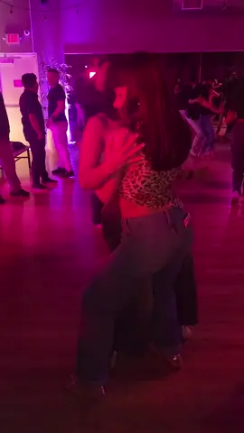A post by @ritmoconson on TikTok caption: Valeriia & Alexis dancing at the Houston Loves bachata Anniversary  💃 @valeriiazosimova 💃 @alexis.moore  🎫 @houstonlovesbachata  #bachatasensual #bachatahouston #houstonlovesbachata 
