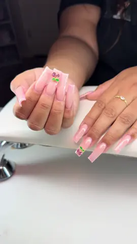 A post by @_nailzbymariah_ on TikTok caption: #nailzbymariah #goodyearnailtech #aznails #athomenailtech #explorepage #explorepage #vbeautypure #beetlesgelpolish #kupatopcoat #nailsandblinks #frenchtipnails #summernails #glitterfrench #cherrycharms 
