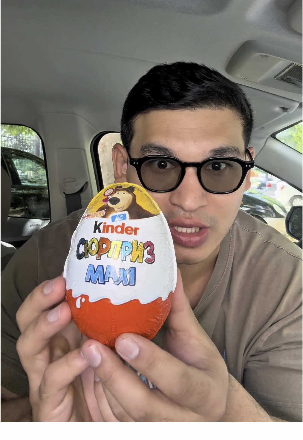A post by @prettymanbro on TikTok caption: Kinder surprise mukbang🥚 #mukbang #carmukbang #food #dessert #chocolate 