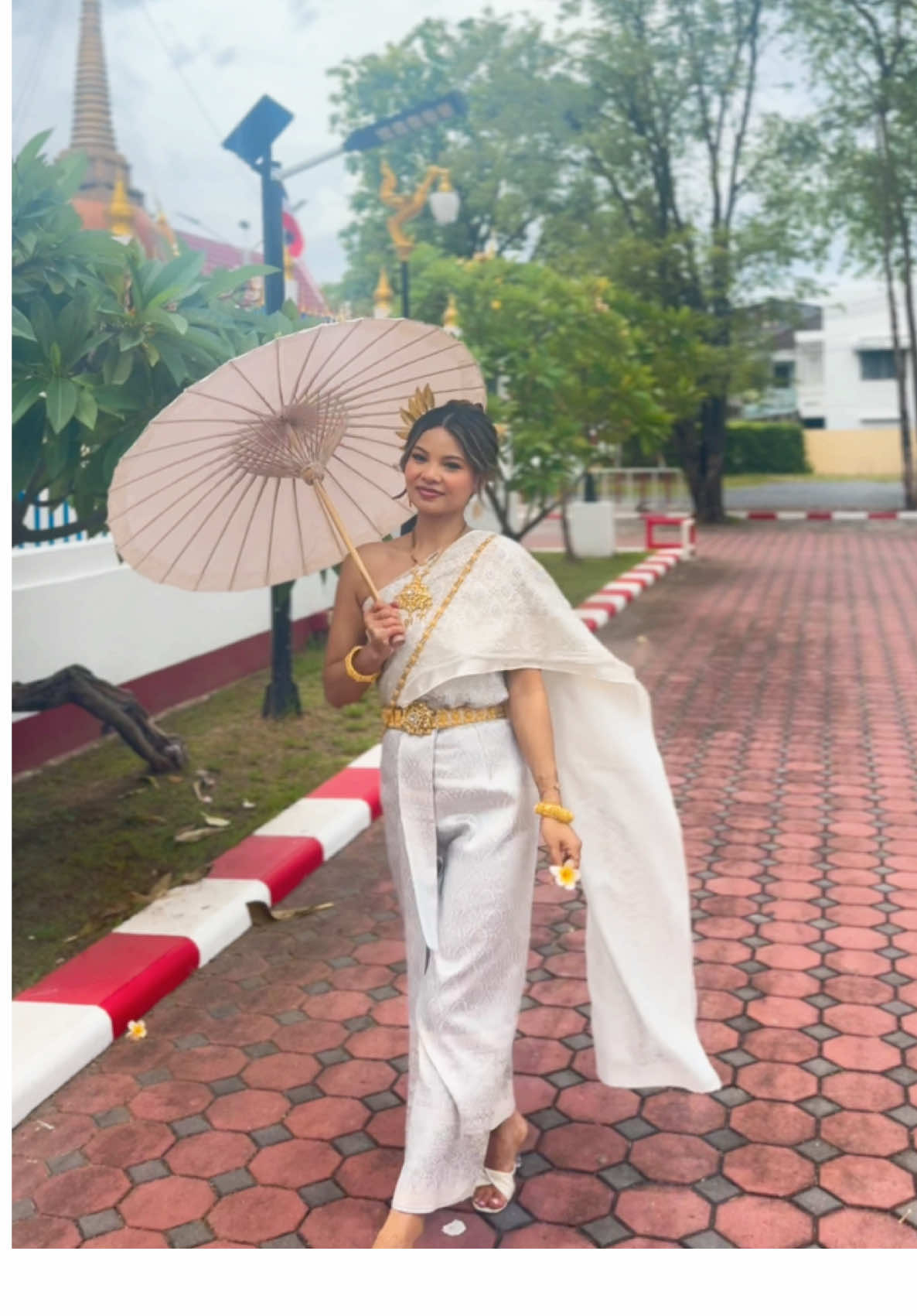 A post by @yoshna on TikTok caption: Felt so pretty 🥹🤍🤍 #thailand #travel #thaioutfit #royals #temple #honeymoon #nepali #fyp #ootd 
