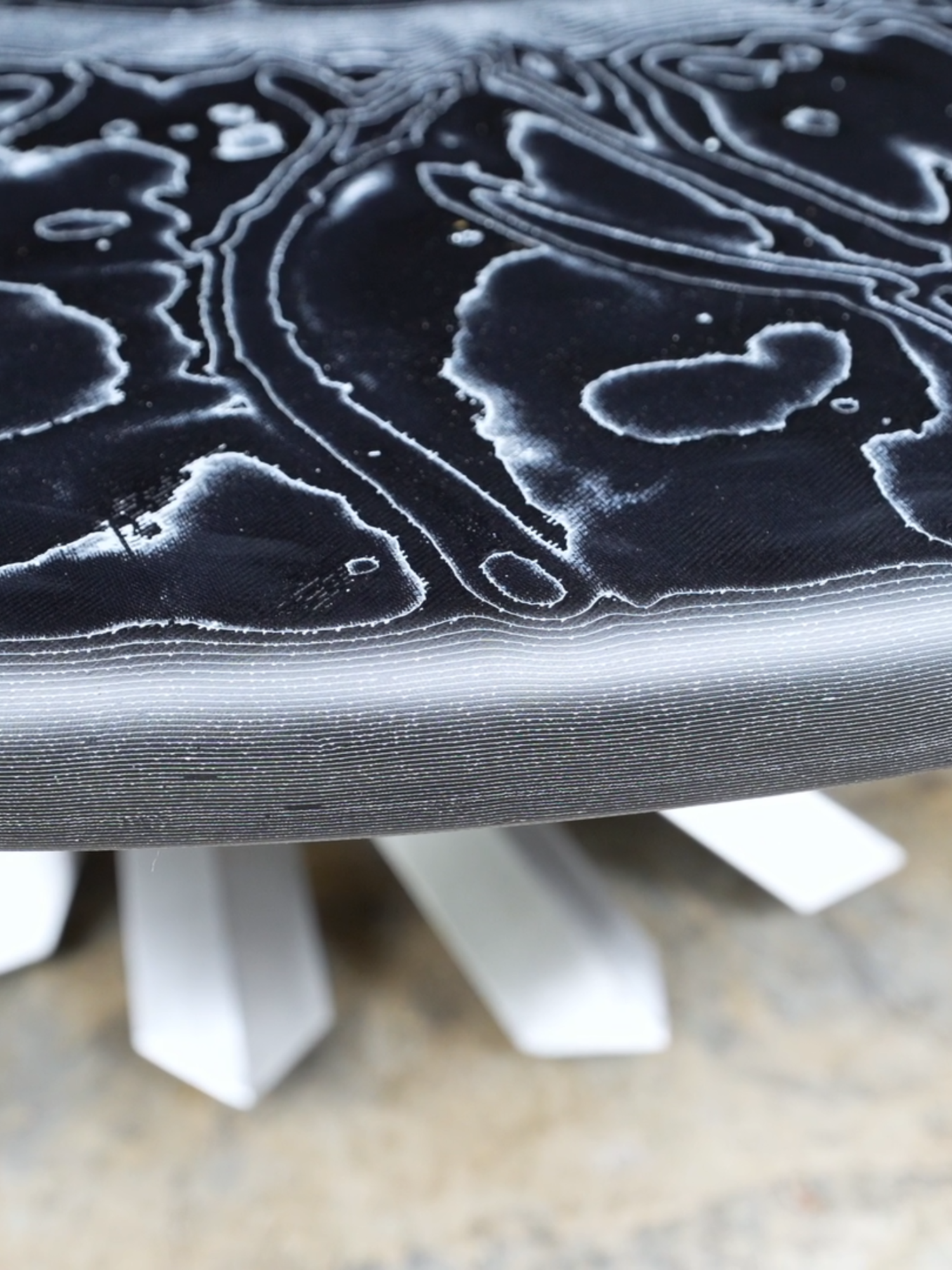 A post by @blacktailstudio on TikTok caption: Foil and epoxy furniture