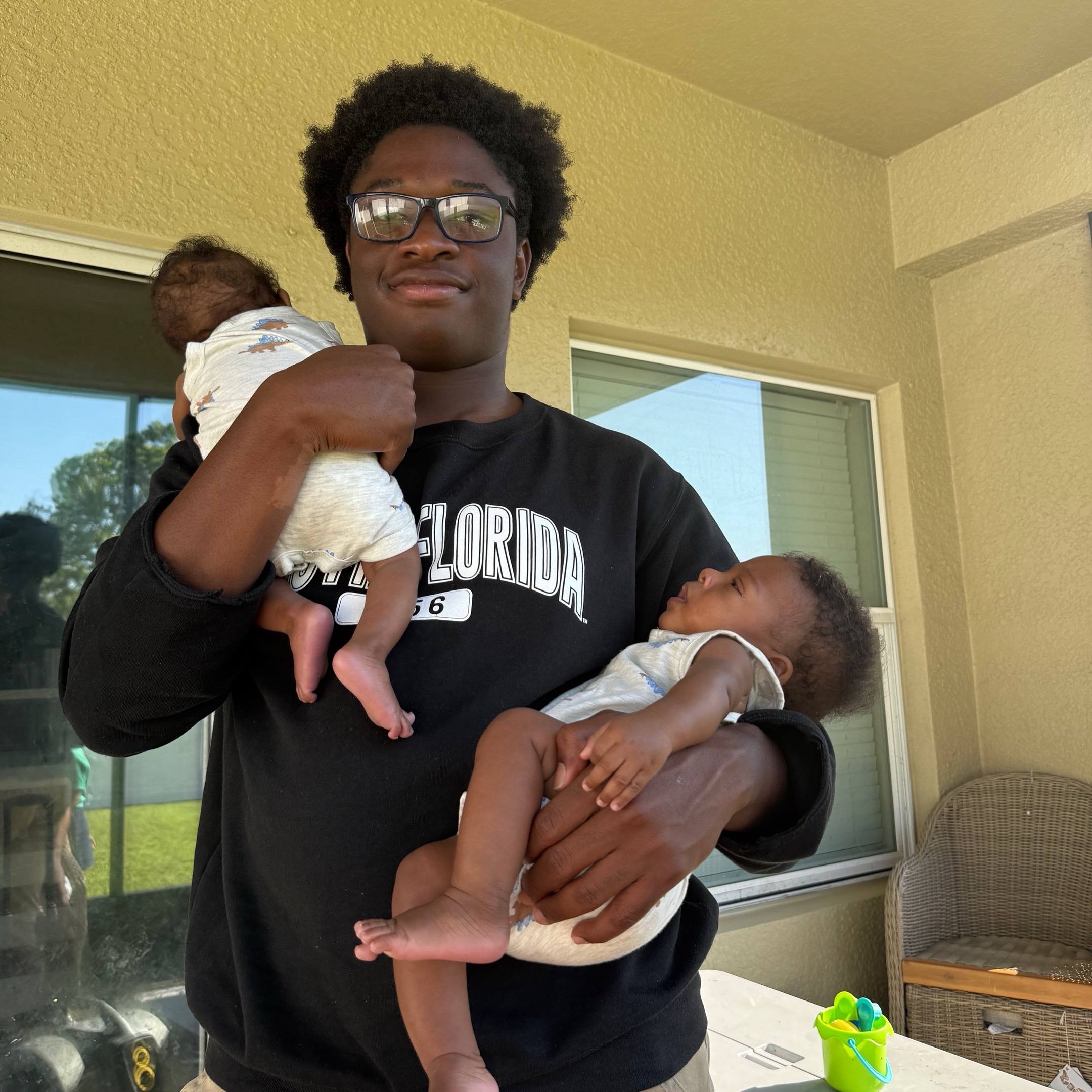 A post by @peach.mcintyre on TikTok caption: I REALLY HAVE A 17 YEAR OLD 🧑🏾 & 4 MONTH OLD TWINS 👶🏾👶🏾 WHEN MY TWINS 👶🏾👶🏾 TURN 17 MY 17 YEAR OLD 🧑🏾 WILL BE 34 YEARS OLD 🤣🤣🤣